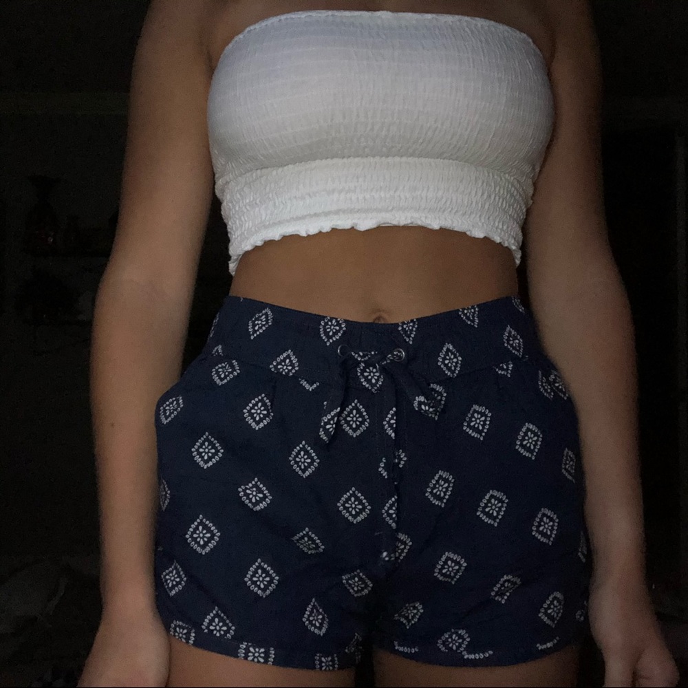flowy patterned shorts.